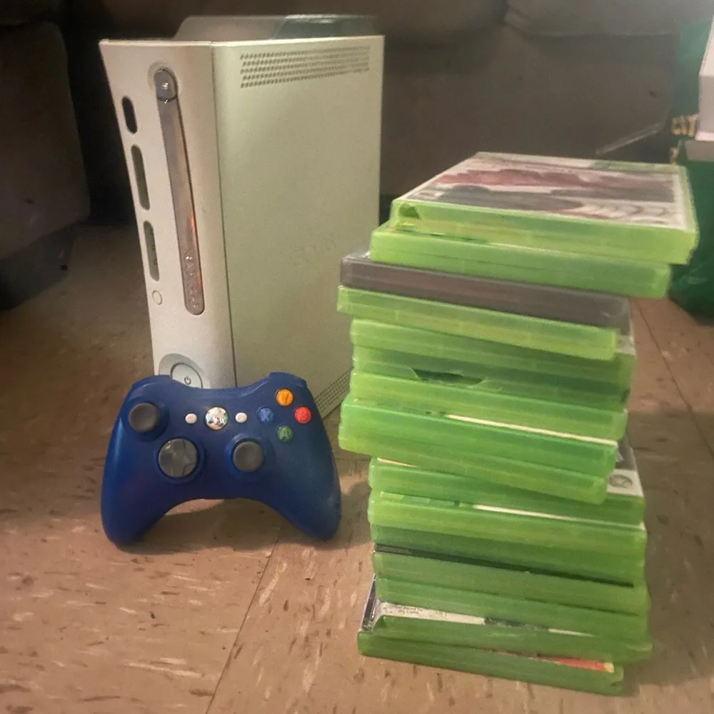 White Gaming Console with Blue Controller and Game Set